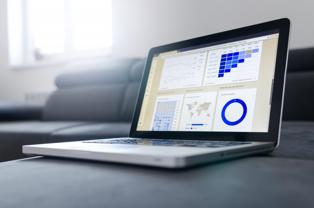 Laptop showing hcm software payroll data