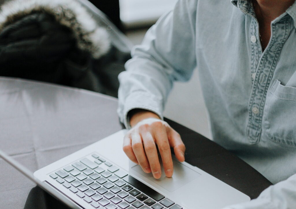 a man looking up the paycheck protection program on his computer